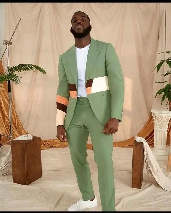 man wearing suit and sneakers