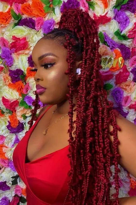 Pretty woman wearing red butterfly braid