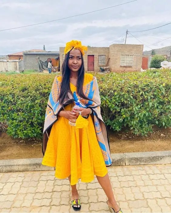 Woman wearing traditional Sotho fabric top