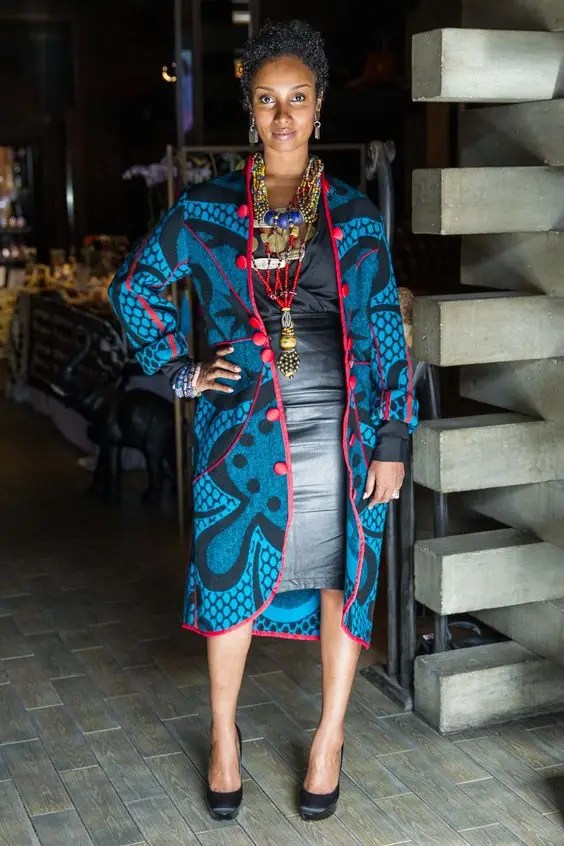 A woman wearing a long jacket made of Sotho fabric
