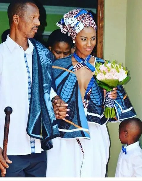 A couple wearing Soto cloth costumes