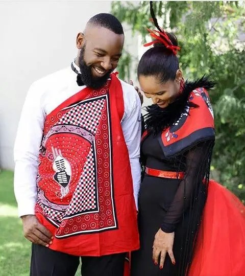 Shy couple in traditional Swazi costume