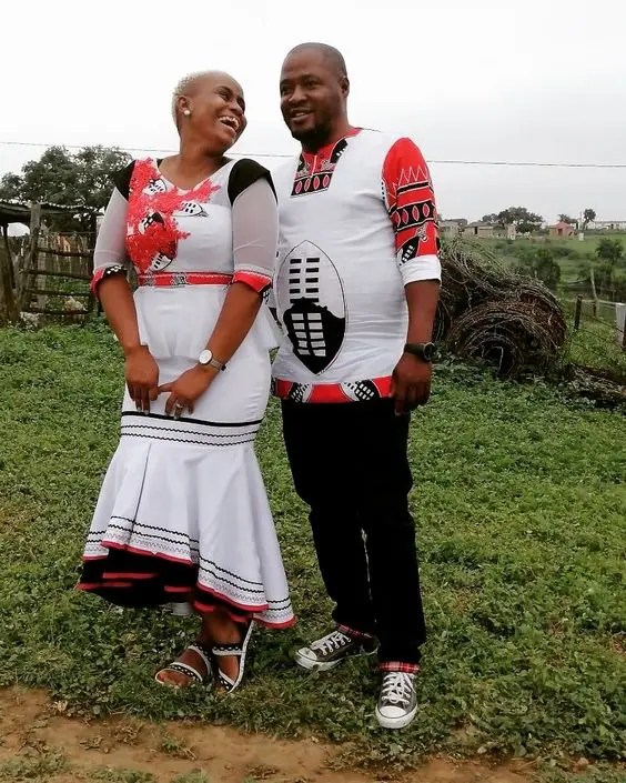 Smiling couple wearing traditional swazi costume