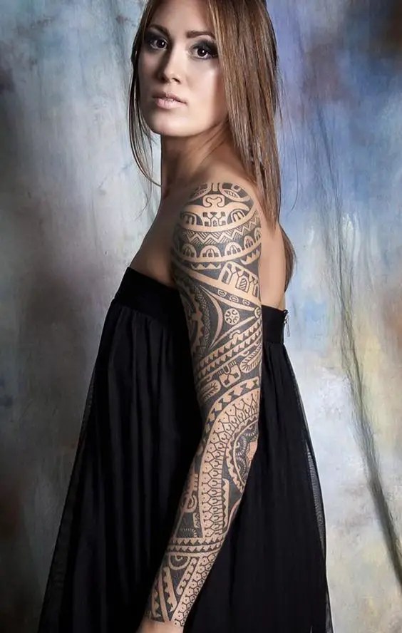 lady wearing a tribal tattoo sleeve