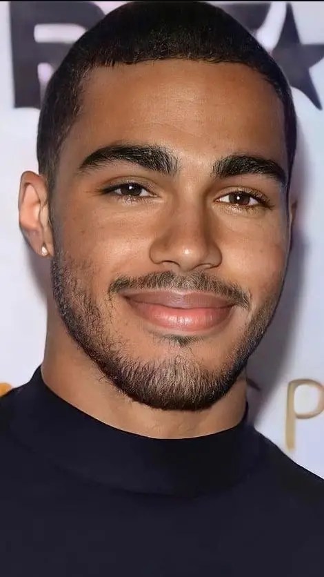 Smiling man finding a simple mustache style