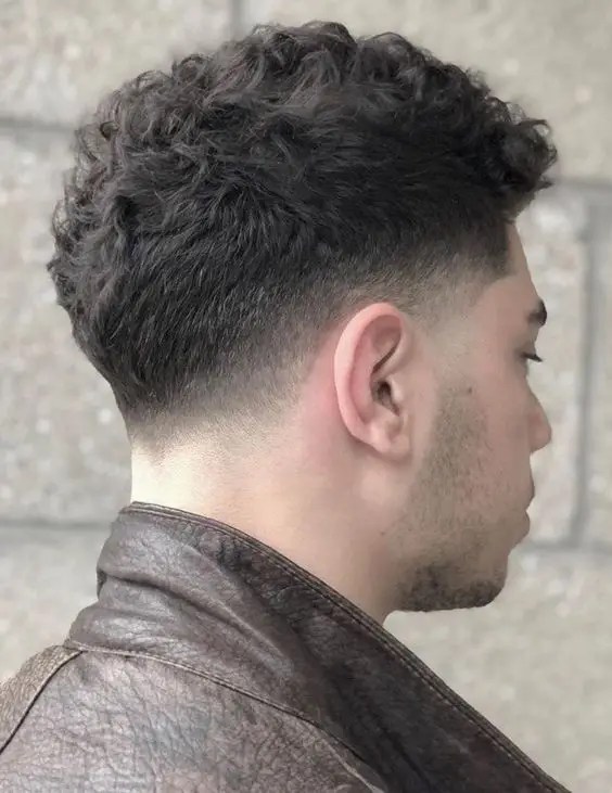 Back view of man wearing short hair fade