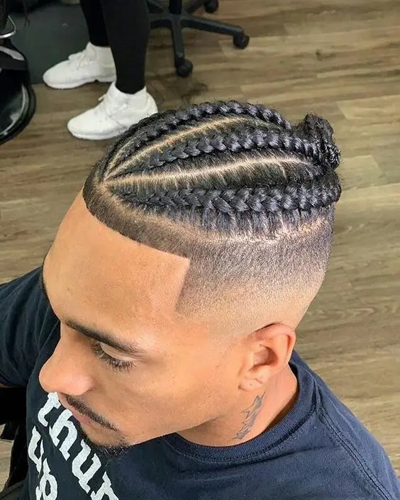 man wearing braids with fades
