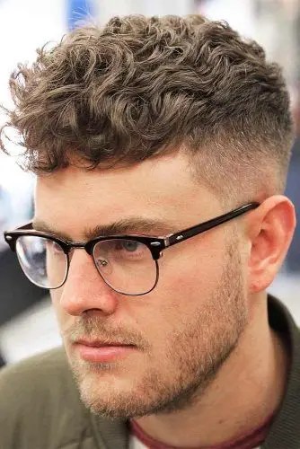 Caucasian man with short hair and faded glasses