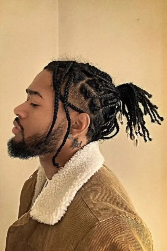 Side view of man wearing men's braid hairstyle