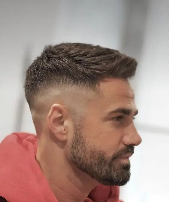 Caucasian man wearing men's hairstyle with fade