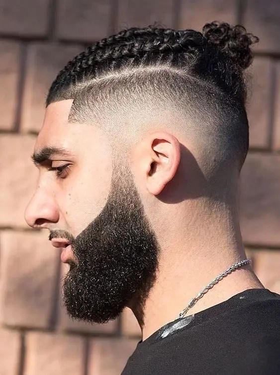 man wearing fade with short braid hair
