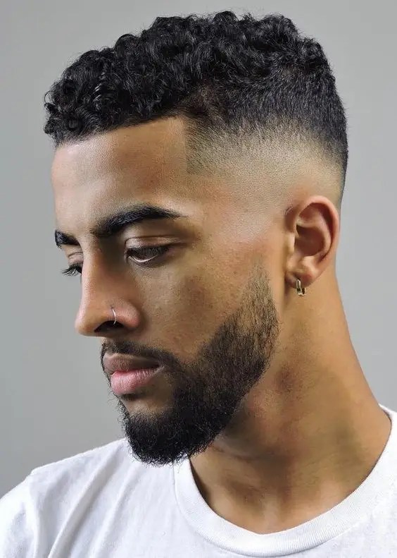Man with beard wearing hairstyle with fade