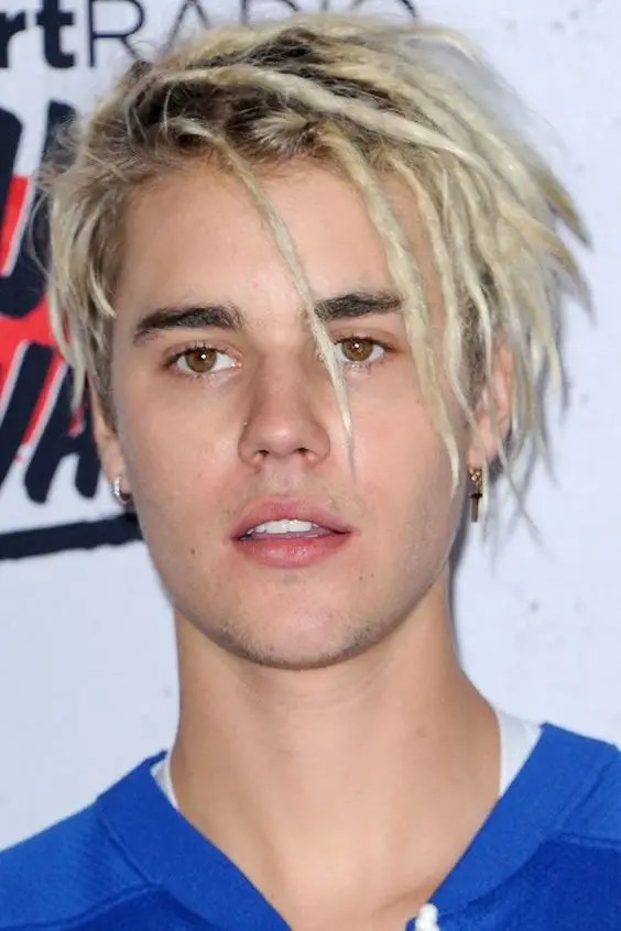young Justin Bieber rocking blonde hairstyle