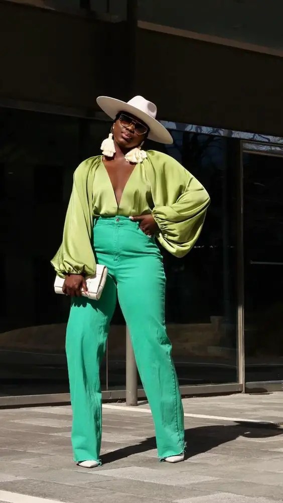 Woman in shirt with palazzo and hat
