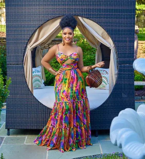 Woman in multi-print maxi dress with cutouts