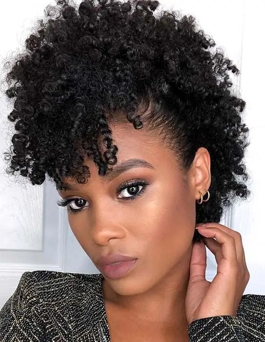 Woman wearing natural hair in afro hawk