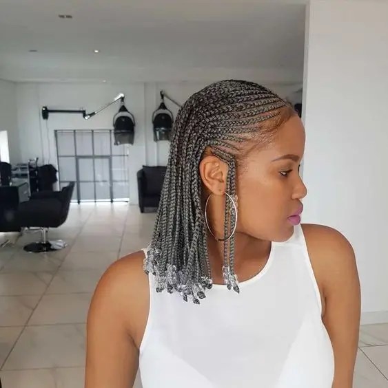 Woman wearing short braids with beads