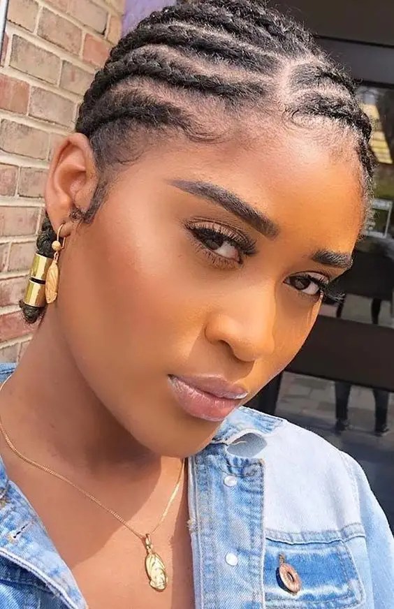 Woman wearing short cornrows in her natural hair