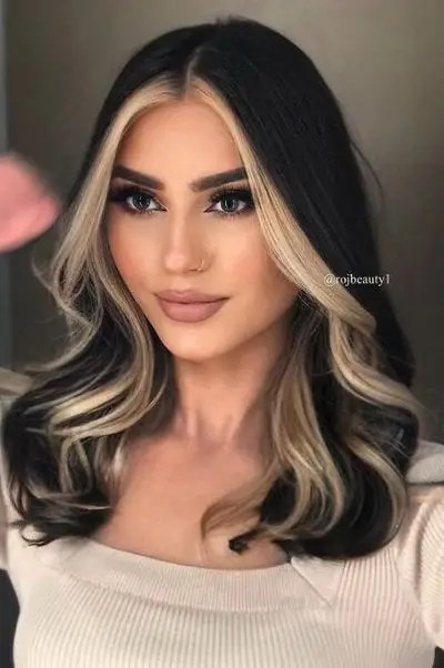 Beautiful woman with blonde highlights rocking her dark hair