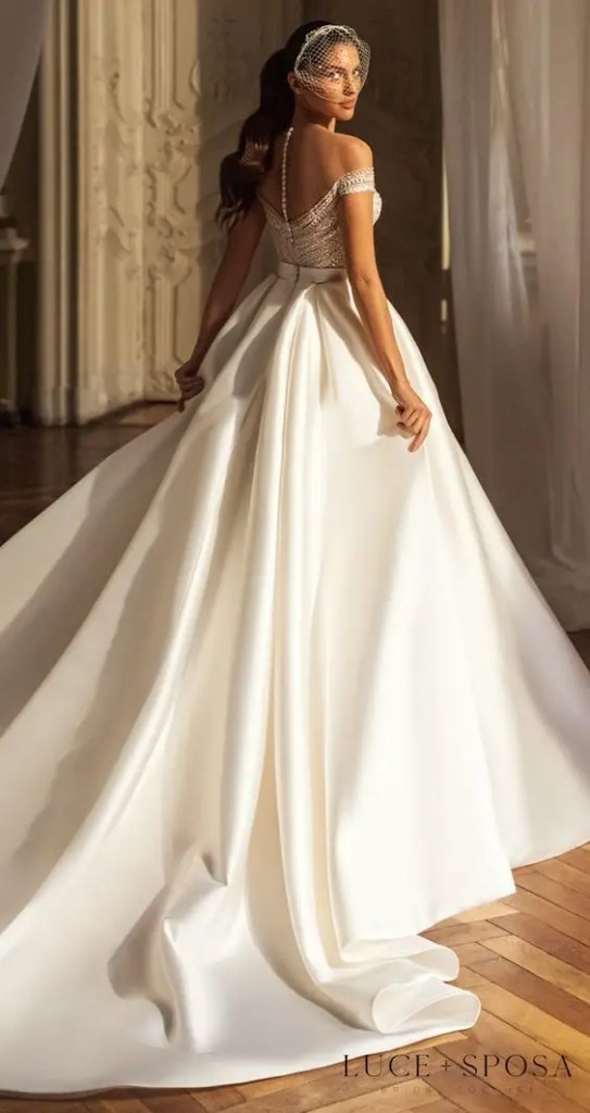 Woman wearing corset wedding dress indoors