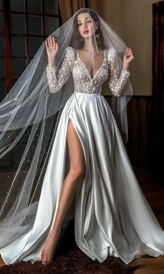 Beautiful bride in wedding dress with veil and corset