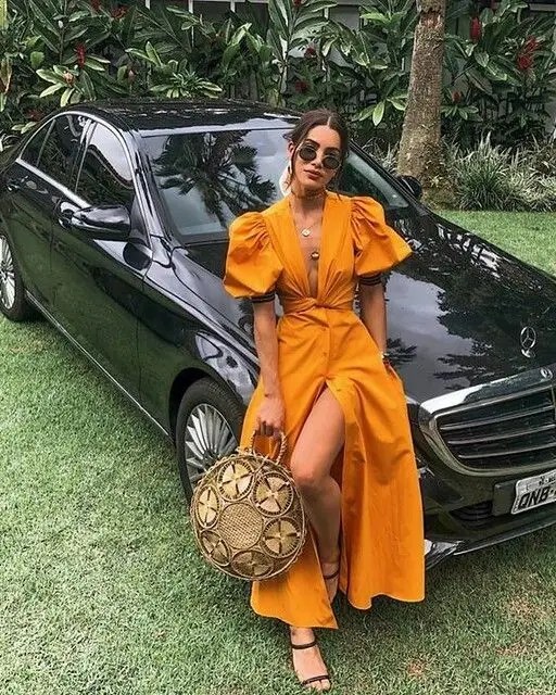 woman in dark yellow maxi dress