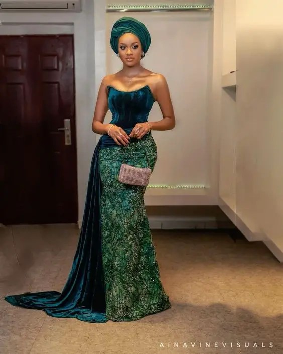 Woman wearing green strapless lace gown style