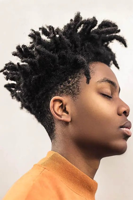 man rocking short dreadlocks with fades