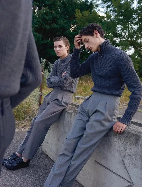 Two men wearing high-waisted men's ash pants with a sweater