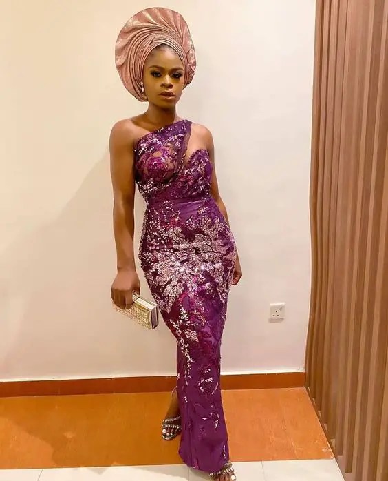 Woman wearing deep purple lace gown style gel for wedding