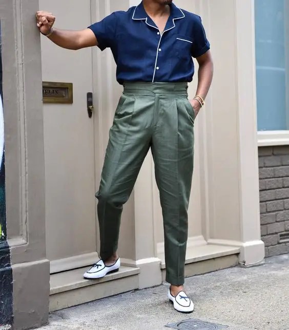 Man wearing men's high-waisted pants over pajamas