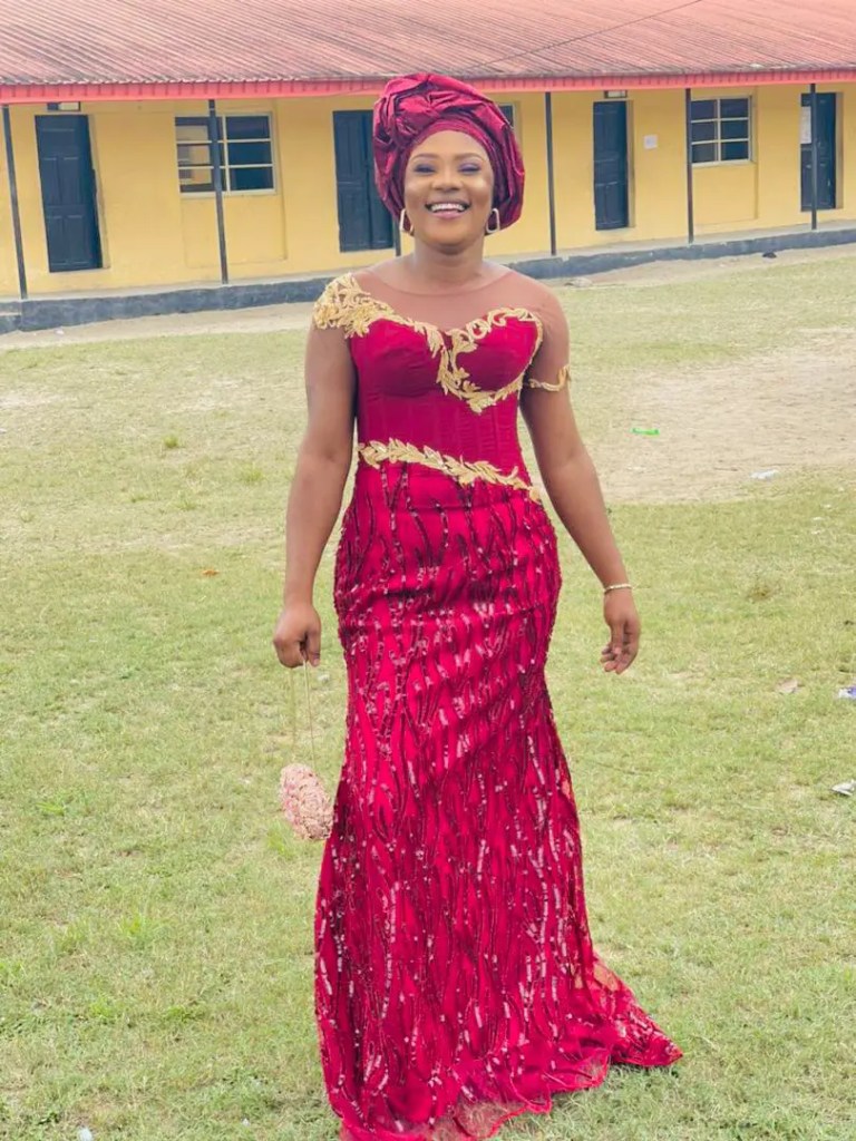 Woman in red dress lace gown at a wedding