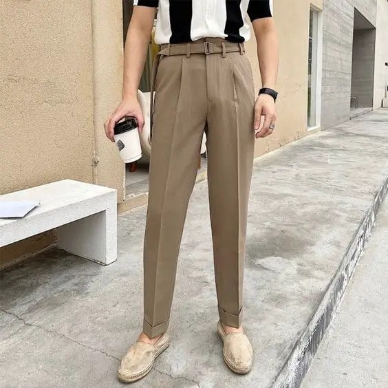 Man wearing light brown men's high-rise pants