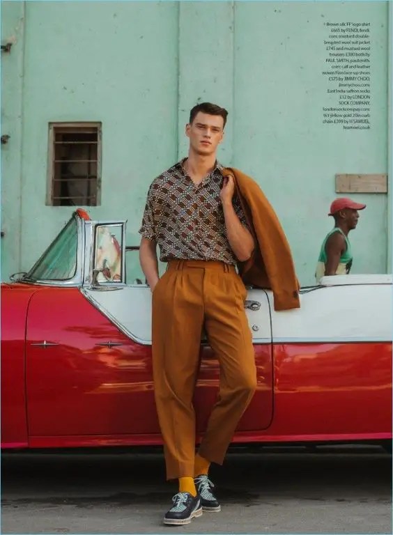 a guy wearing high-waisted pants suit with a vintage shirt