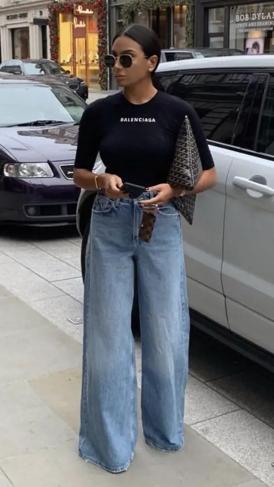 A woman with sunglasses and a Balenciaga t-shirt as her Election Day outfit