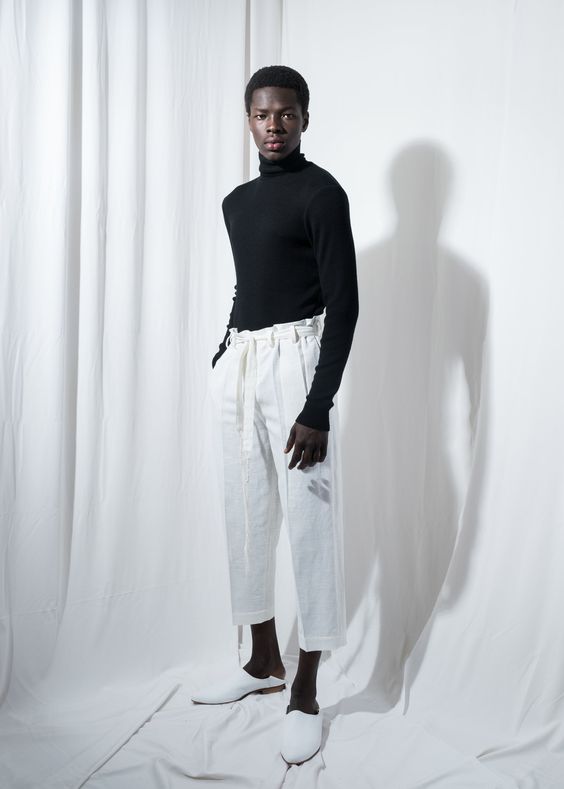 Man in 3/4 length high-rise pants with turtleneck top