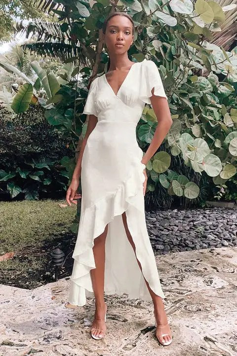 Woman in off-white high-low silk dress
