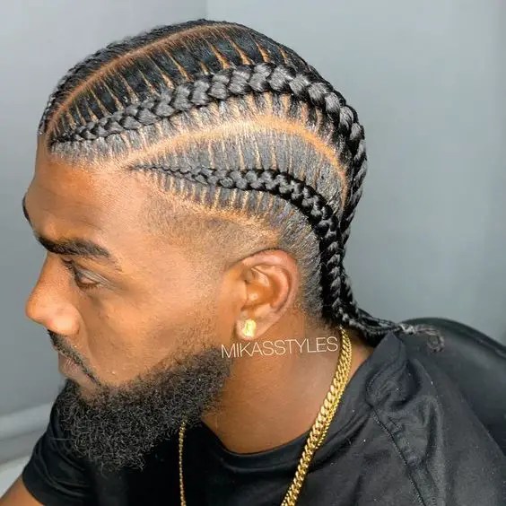 man wearing stitched cornrows