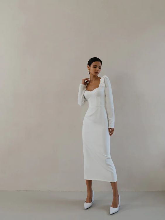 Woman wearing a long sleeve midi dress as a casual wedding dress