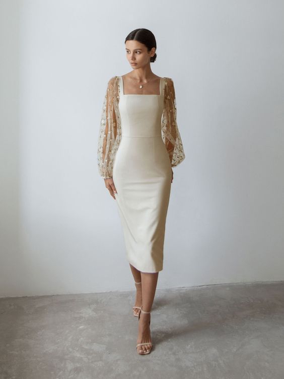 Woman in off-white midi dress