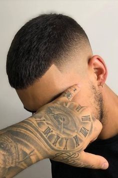 Tattooed man wearing a wiffle cut