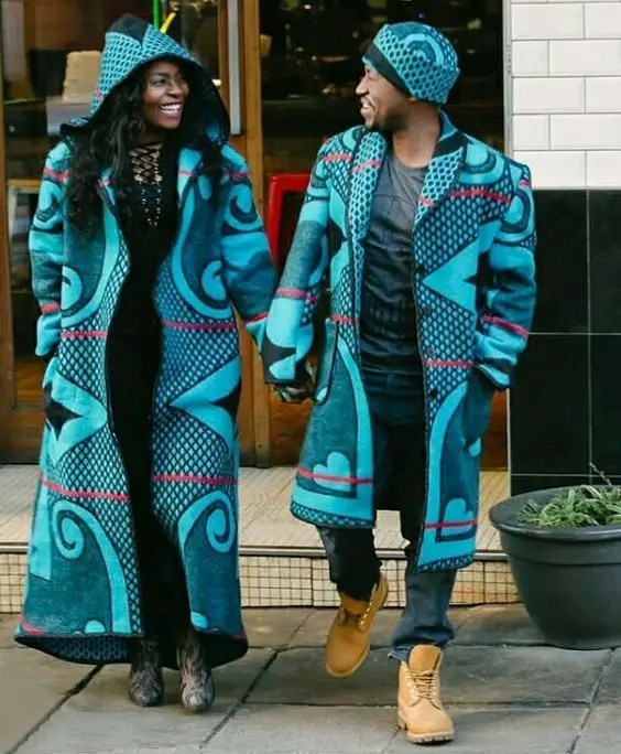 A couple wearing modern soto blankets