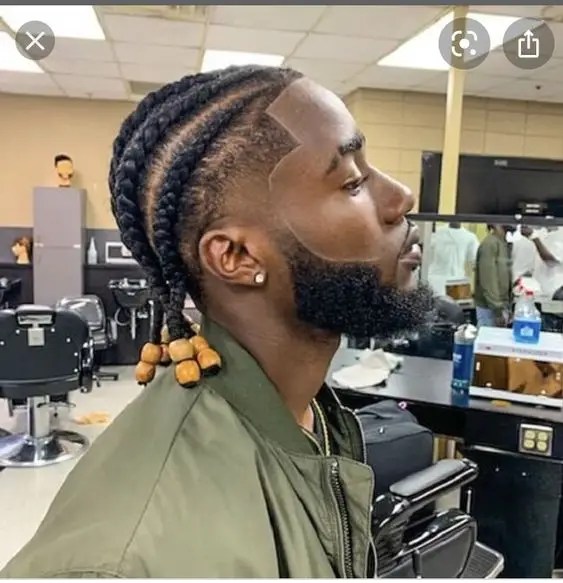 Side view man showing off cornrow braid hairstyle for men