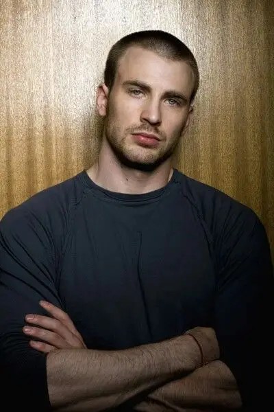 Chris Evans shows off his low cut with folded hands