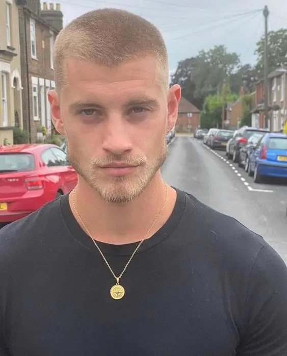 Man looking into the camera showing his haircut