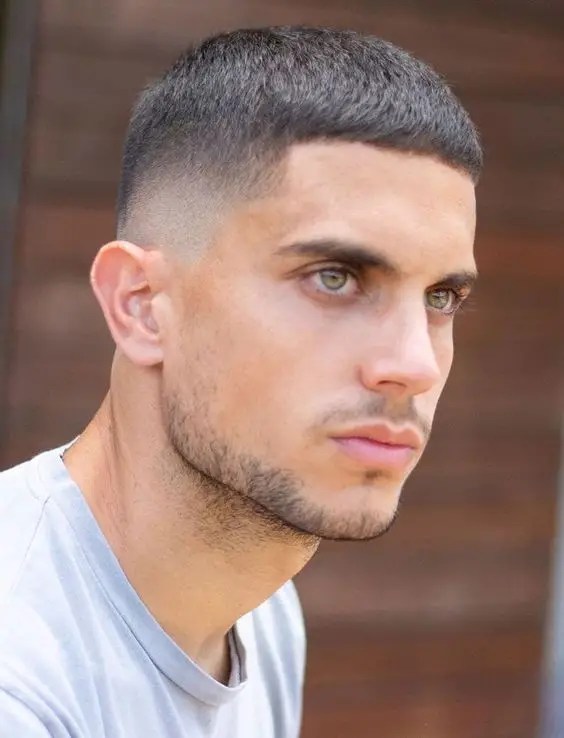 man with olive eyes showing low cut