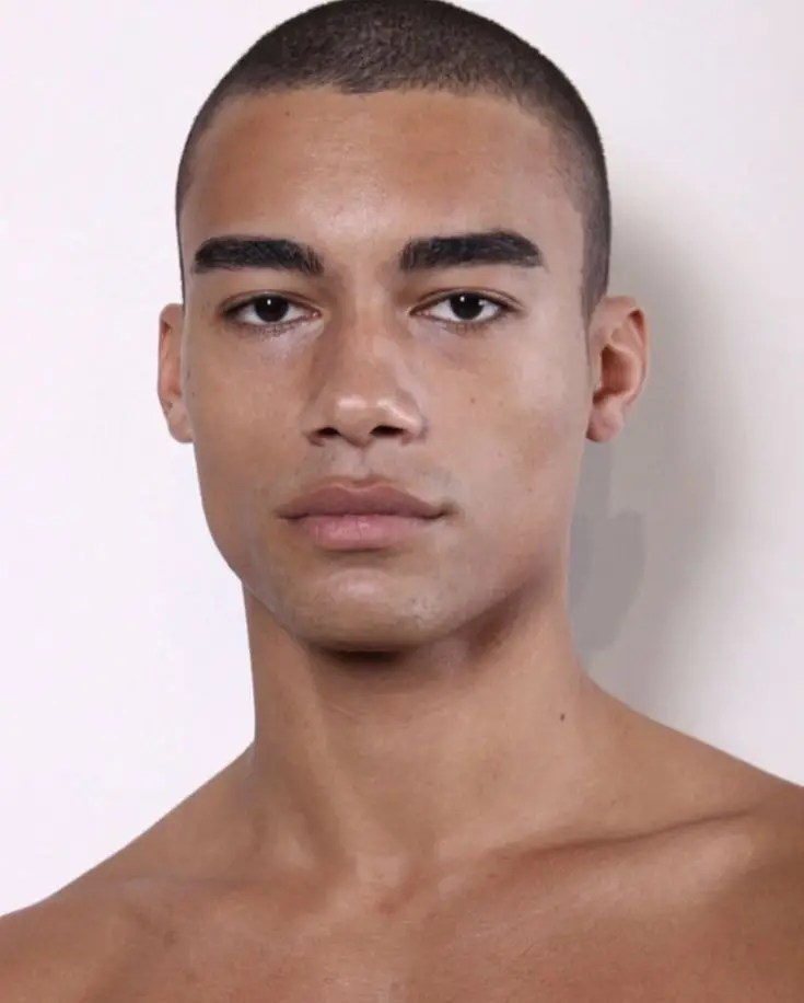 Man with eyebrows wearing buzz haircut