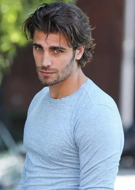 man rocking wolf cut hairstyle