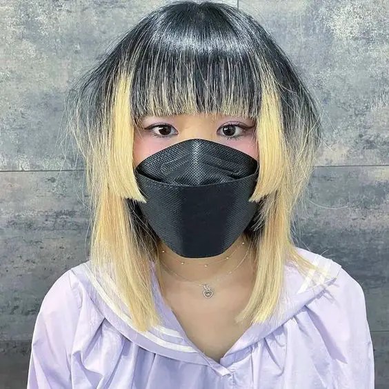 Asian woman rocking layered bangs