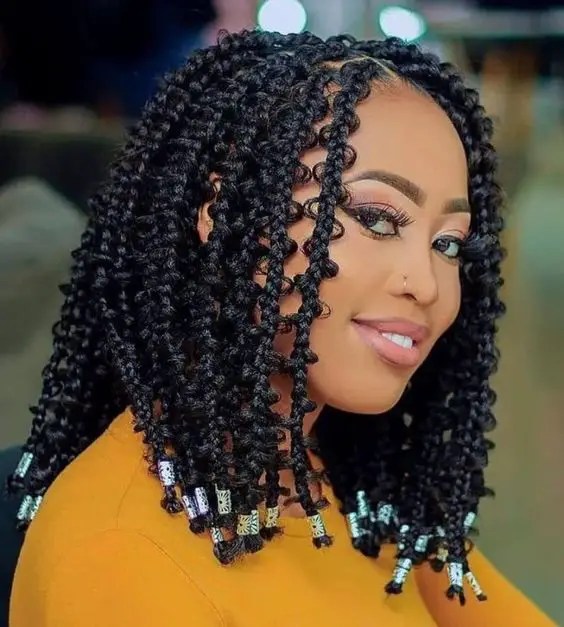 Pretty smiling woman showing off her tribal braids